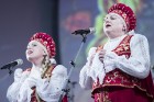 XXV Vispārējo latviešu dziesmu un XV deju svētku ietvaros pirmdien, 1. jūlijā, Lielajā Ģildē notika mazākumtautību kolektīvu koncertuzvedums Zem viena 32