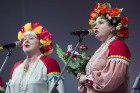 XXV Vispārējo latviešu dziesmu un XV deju svētku ietvaros pirmdien, 1. jūlijā, Lielajā Ģildē notika mazākumtautību kolektīvu koncertuzvedums Zem viena 36
